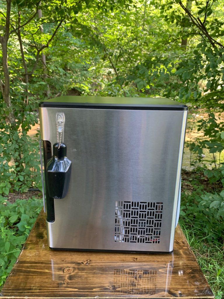 side of the opal countertop ice maker with the included ice scoop